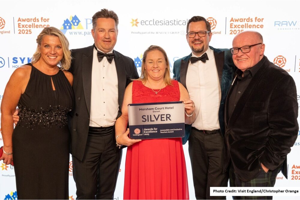 Hotel representatives holding their award.