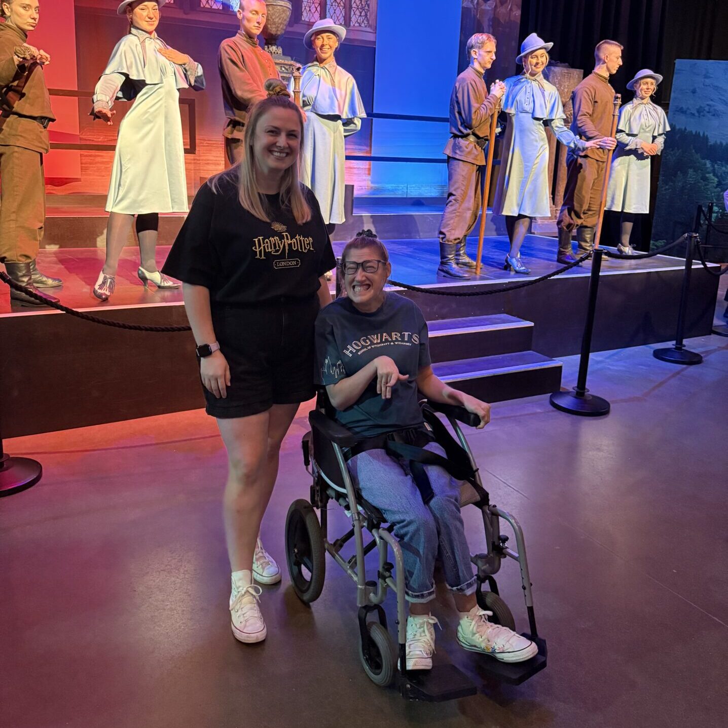 Hannah and Becky in front of a special Triwizard cup anniversary display. It features actors dresses in the school uniforms of the wizarding schools involved in the Triwizard competition. 