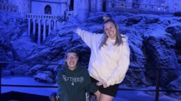Hannah and Becky Cheetham at the Warner Bros. Studio Tour London -The Making of Harry Potter. They are pictured in front of the Hogwarts castle.