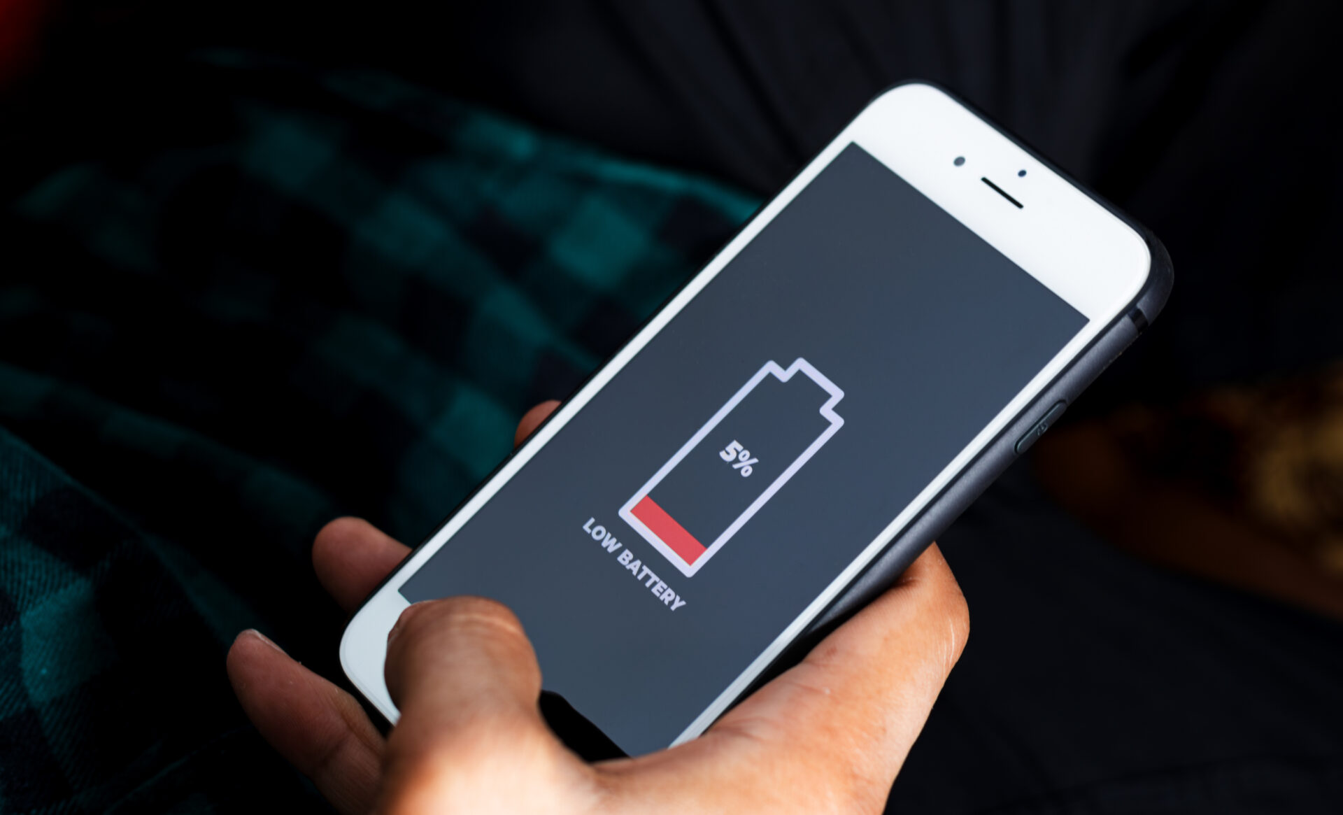 An image of a phone with a low battery indicator on the screen.