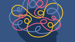 An abstract graphic of a person's head with colourful squiggly lines shown over it, meant to convey feelings of anxiety, ADHD, obsessive thoughts etc.